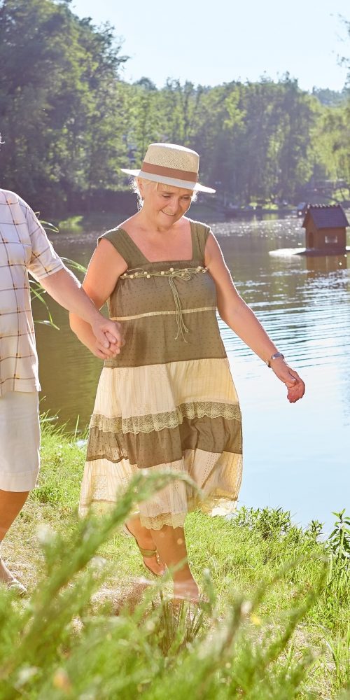 senior couple walking near lake 2021 09 02 02 48 43 utc min