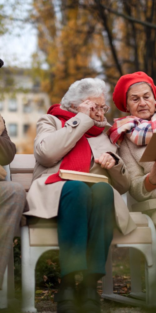 group of senior friends sitting on bench and readi 2022 01 18 23 20 52 utc min