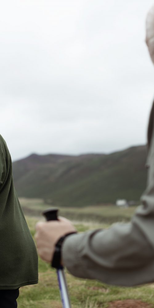 happy seniors walking with trekking poles 2021 08 27 00 05 09 utc min