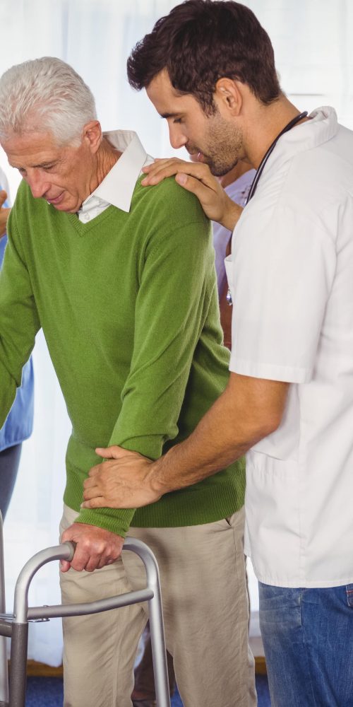 nurse helping seniors walking with a walker 2021 08 28 17 21 16 utc min