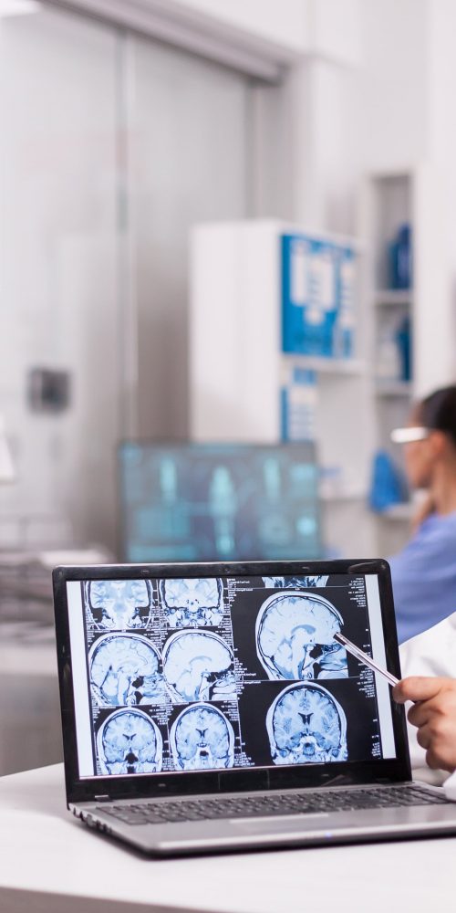 radiologist pointing at brain ct scan 2021 08 29 11 15 54 utc min