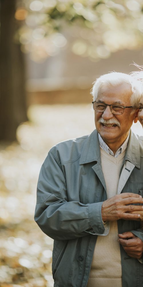 senior couple walking in autumn park 2022 04 19 01 44 34 utc min