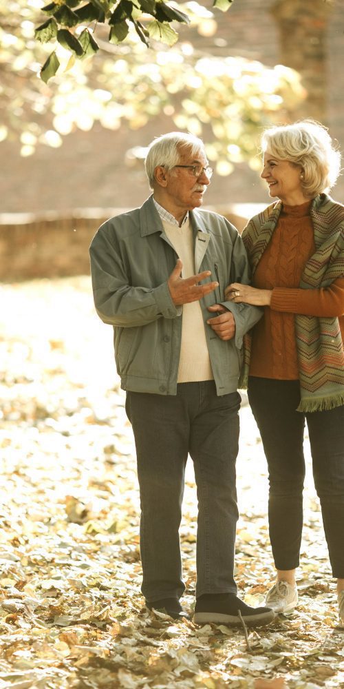 senior couple walking in autumn park 2022 04 19 01 44 59 utc min