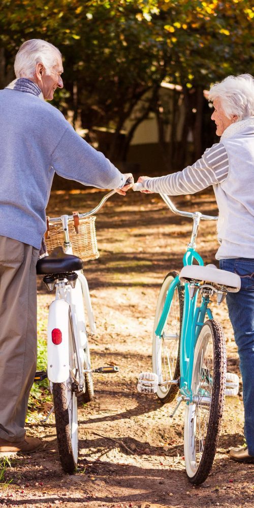 senior couple walking next to their bike 2021 08 28 22 13 46 utc min