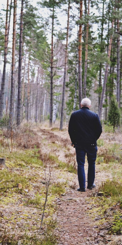 senior man walking on a path in the forest 2021 08 29 02 32 05 utc min