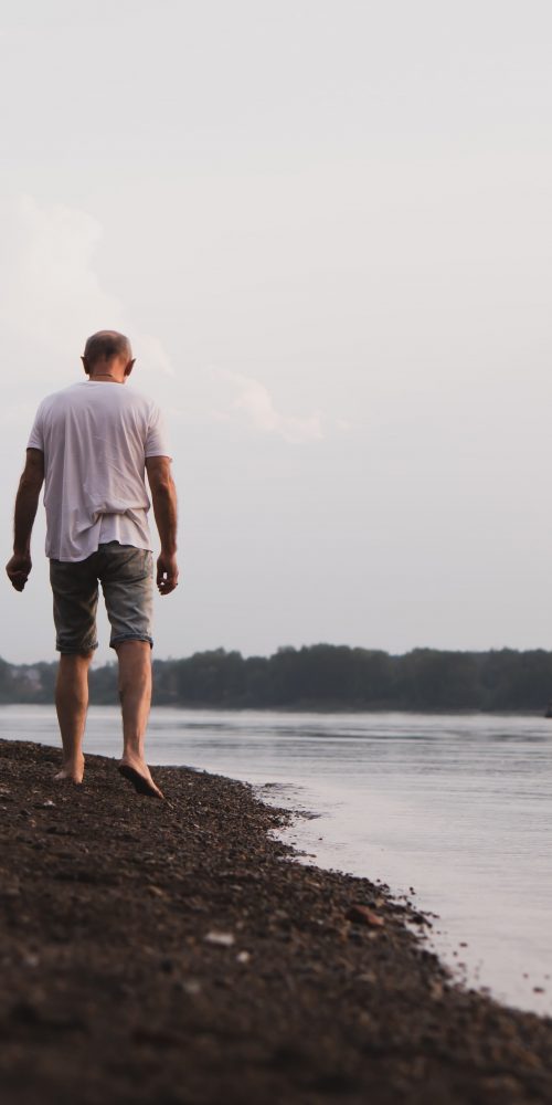 senior man walking on the beach 2022 03 24 23 38 51 utc min