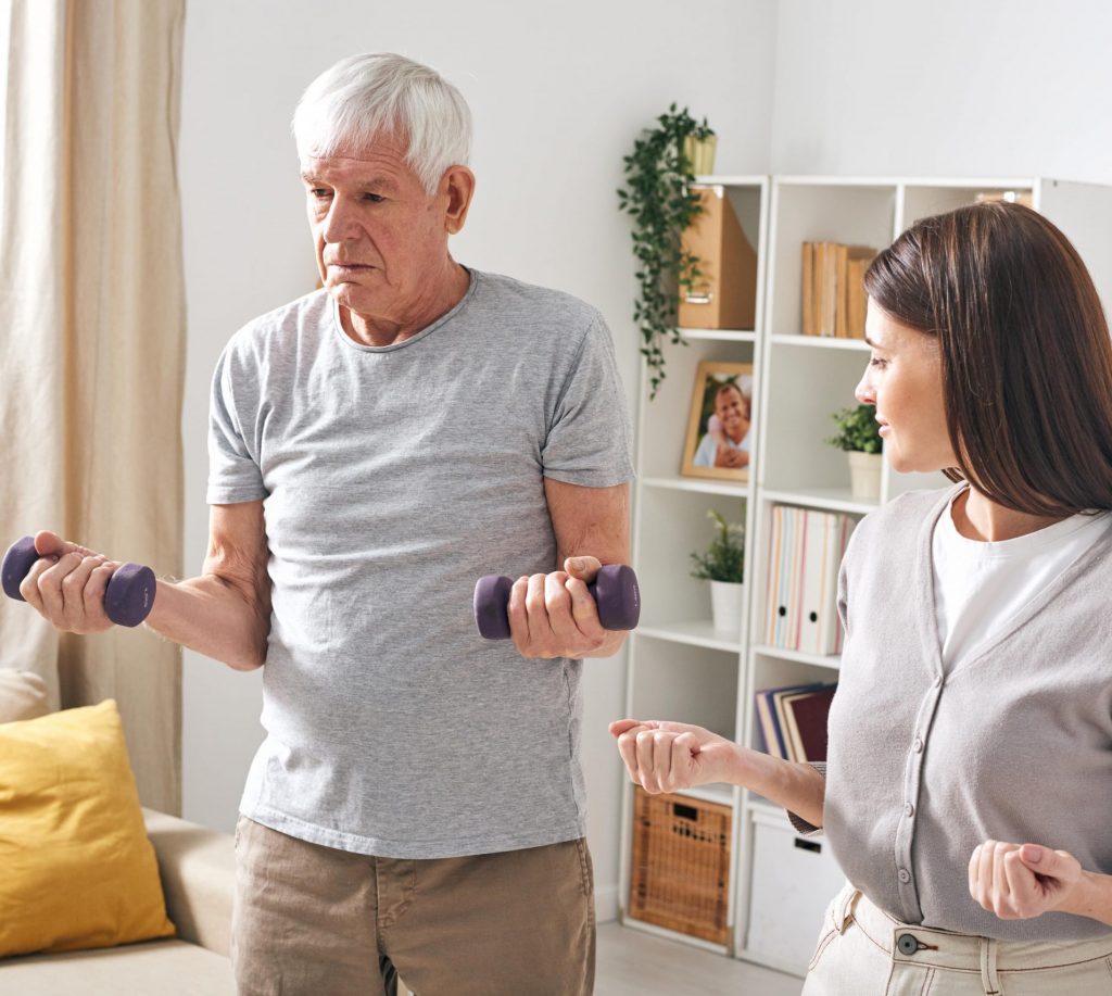 social worker helping senior to rehab 5ML9WKC min scaled e1632469823264