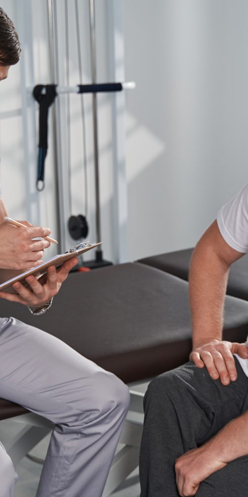 young physiotherapist explaining for wheelchair ma 2023 11 27 05 33 26 utc